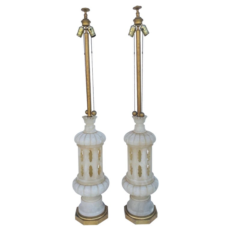 Monumental pair of Marble Lamps made in Italy: Monumental pair of Italian made marble lamps having gilded-octagonal wooden bases and long brass necks.The lamps have beautiful lines, they are very tall and very well executed.The pieces have the ori
