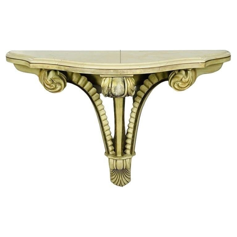 Art Deco Wall Console with a Marble Top, USA, 1940s: Introducing our exquisite Art Deco Wall Console With a Marble Top, proudly made in the USA during the 1940s. Measurements: 42.50 inches wide x 13 inches deep x 27.25 inches high. All items are sold