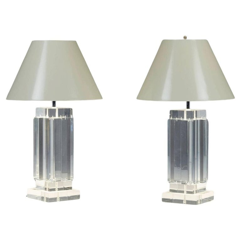 Pair of Lucite Table Lamps attb to 'Les Prismatiques': Elevate your home decor with this exquisite Pair of Lucite Table Lamps attributed to "Les Prismatiques" France 1970's.These stunning lamps feature clear Lucite bases that exude a modern and sophistica