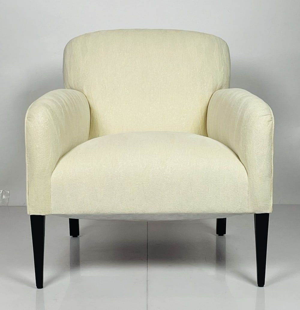 Vintage Arm Chair in the Style of Paul McCobb, USA 1960's: Vintage Arm/Lounge chair made in the 1960s in the style of Paul McCobb.The Chair is upholstered in an off white fabric with black legs.Unmarked.Measurements:30 inches high x 29 inches wide x 31.50 dee