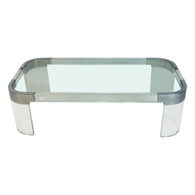 Lucite & Polished Nickel Coffee Table by Charles Hollis Jones, Signed: Sleek coffee table executed in Lucite, polished nickel with a glass top.The table was designed in the 1970s by the Lucite icon, Charles Hollis Jones.The table is part of Charles Hollis Jones -Waterfal