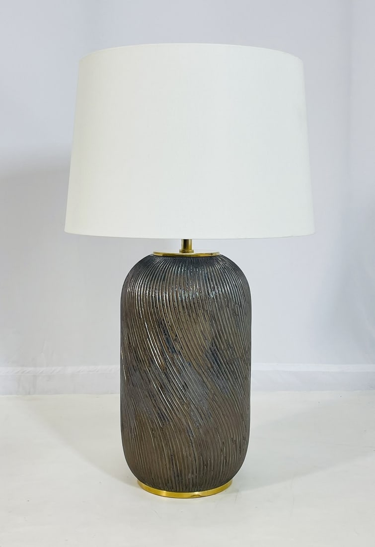 Elegant Reactive Ceramic Table Lamp by Ralph Lauren with Brass Base: This elegant table lamp by Ralph Lauren blends refined craftsmanship with organic texture. The ceramic base features a rich, reactive glaze in a deep brown tone, enhanced by a dynamic swirling texture