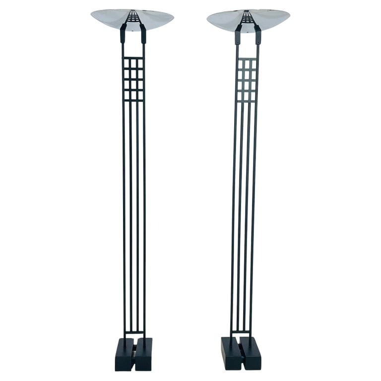 Pair of Floor Lamps/Torchieres by Robert Sonneman for George Kovacs, USA 1987: Pair of Floor Lamps/Torchieres by Robert Sonneman for George Kovacs, crafted in the USA in 1987. These sleek and modern lamps feature a striking black metal base and elegant stainless steel round shad