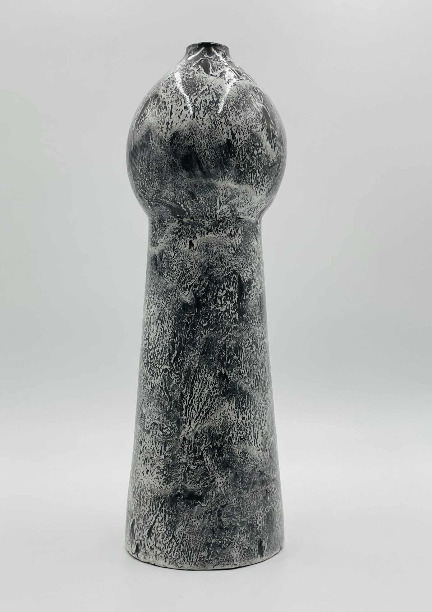 European Ceramic Vase made in Portugal by FAM.: Striking mid-to-late 20th century modern ceramic vase made in Portugal by FAM. This tall vessel features a bold sculptural silhouette with a flared cylindrical body and an organic, bulbous top. The gl