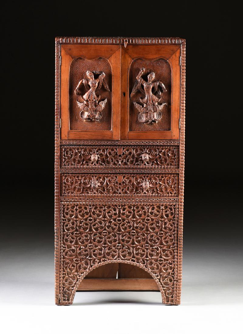 AN INDONESIAN CARVED TEAKWOOD STORAGE CABINET, EARLY (1 of 12)