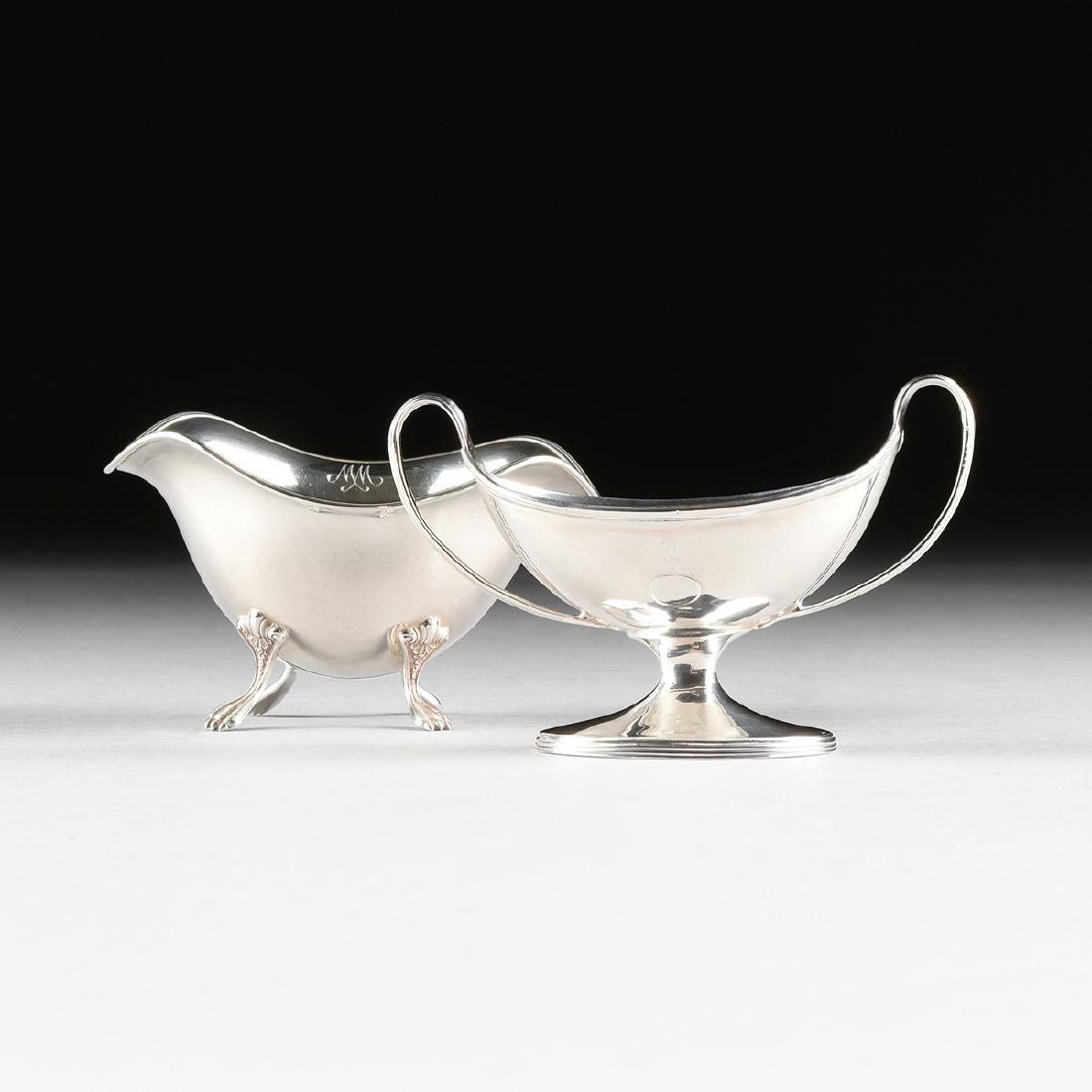 A THOMAS DANIELL GEORGE III PERIOD STERLING SILVER OPEN: A THOMAS DANIELL GEORGE III PERIOD STERLING SILVER OPEN SALT, LONDON, ENGLAND, CIRCA 1787-1788, of half crescent boat form with "D" shape strap handles, raised on oval spreading foot with reeded rim,