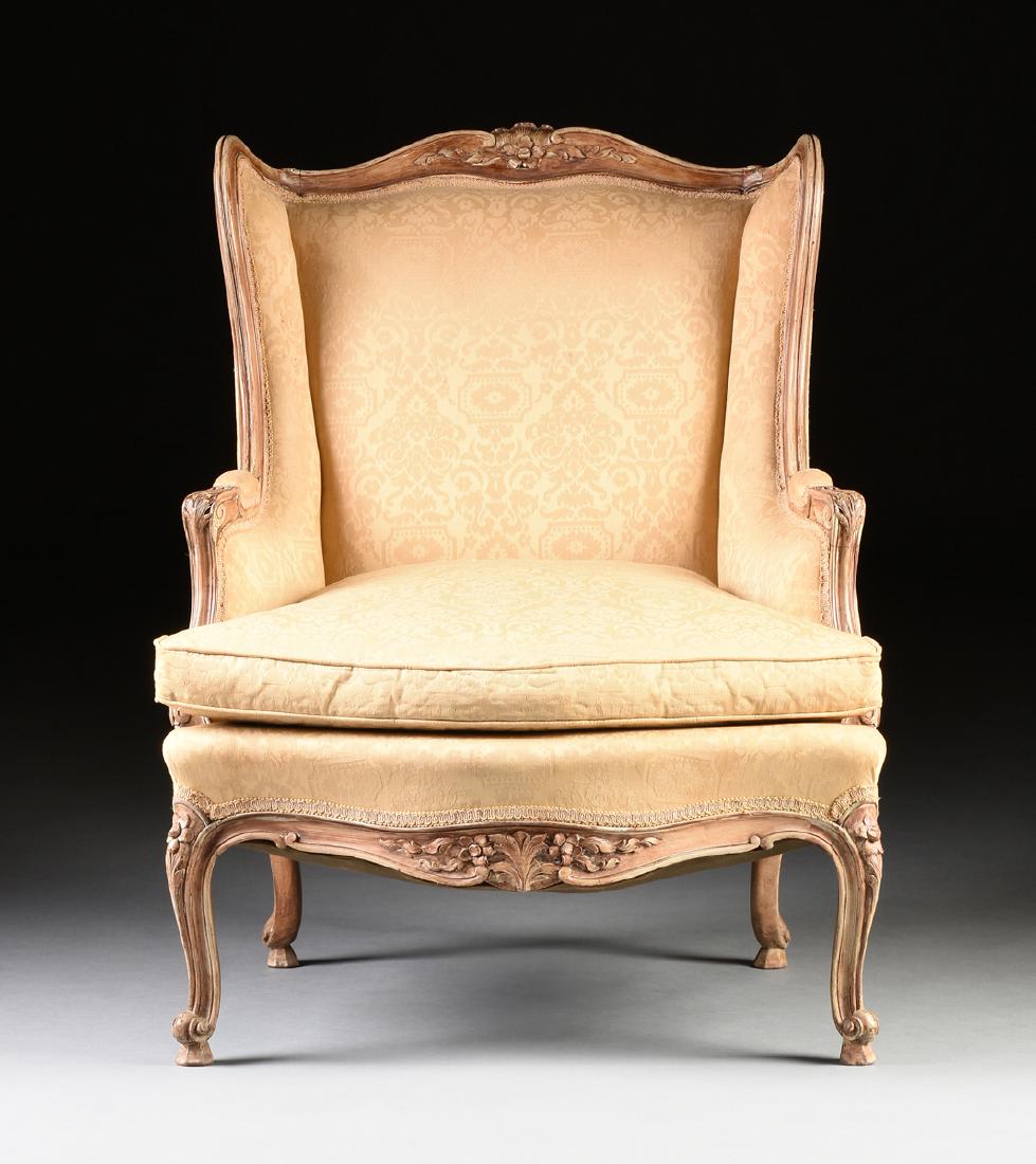 A LOUIS XV STYLE PAINTED BEECH BERGÈRE À LA REINE, LATE: A LOUIS XV STYLE PAINTED BEECH BERGÈRE À LA REINE, LATE 19TH CENTURY, PROBABLY FRANCE, the shell fan and flower bloom arched carved crest flanked by adorsed scrolls and leafy scrolling tendrils, ove
