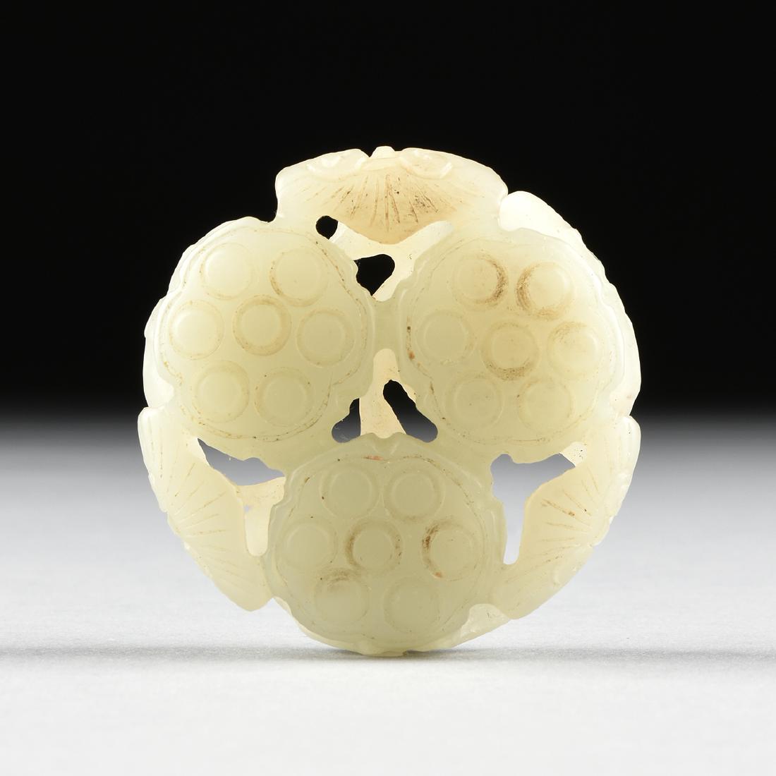 AN OPENWORK CARVED HETIAN JADE LOTUS ROOT PEBBLE, (1 of 6)