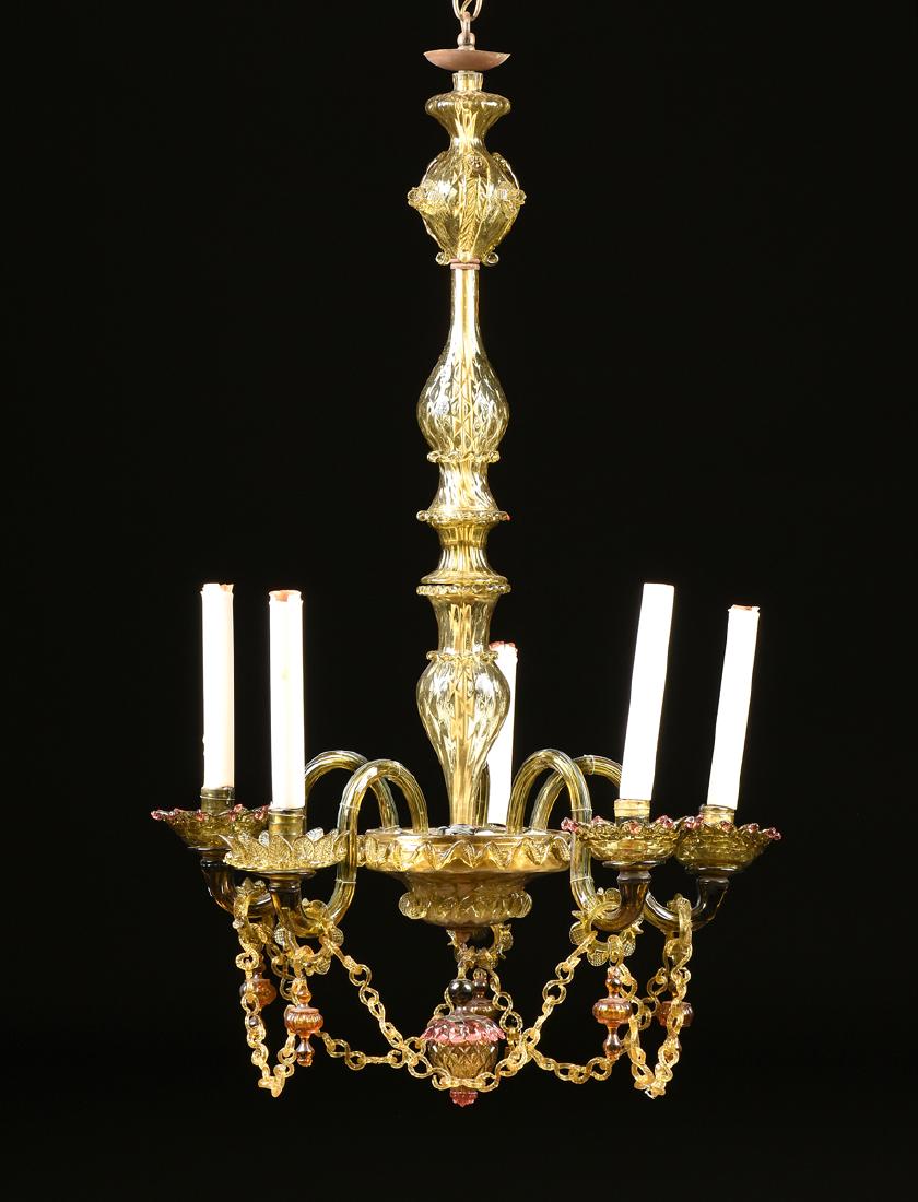 A ROCOCO REVIVAL GREEN, CRANBERRY, AND AMBER MURANO: A ROCOCO REVIVAL GREEN, CRANBERRY, AND AMBER MURANO GLASS CHANDELIER, ITALY, CIRCA 1900-1920, the olive green glass chandelier centering a multi vasiform tapered support with applied flowers, leaves, 