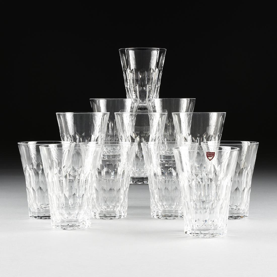 A SET OF TWELVE ORREFORS CUT CRYSTAL FLAT TUMBLERS IN: A SET OF TWELVE ORREFORS CUT CRYSTAL FLAT TUMBLERS IN THE "GATE" PATTERN, SWEDEN, LATE 20TH CENTURY, with flared rims and hexagonal cuts, engraved "Orrefors." Height: 5" Diameter: 3 7/8"