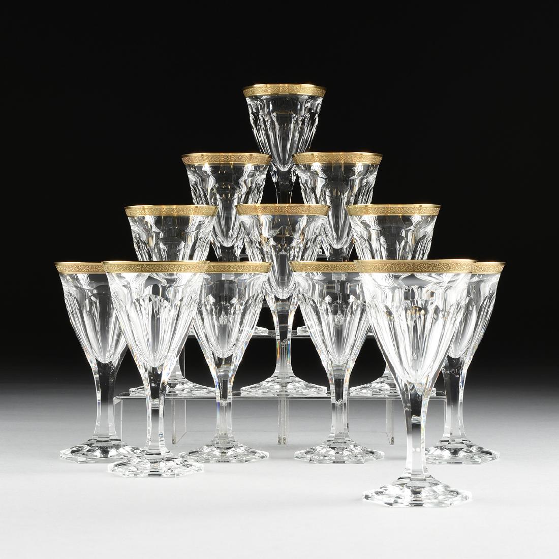A SET OF TWELVE MOSER CUT CRYSTAL RED WINE GLASSES IN: A SET OF TWELVE MOSER CUT CRYSTAL RED WINE GLASSES IN THE "ADELA MELIKOFF" PATTERN, KARLOVY VARY, CZECH REPUBLIC, DESIGNED 1922-1923, CURRENT PRODUCTION, panel cut and raised on hexagonal stem and foo