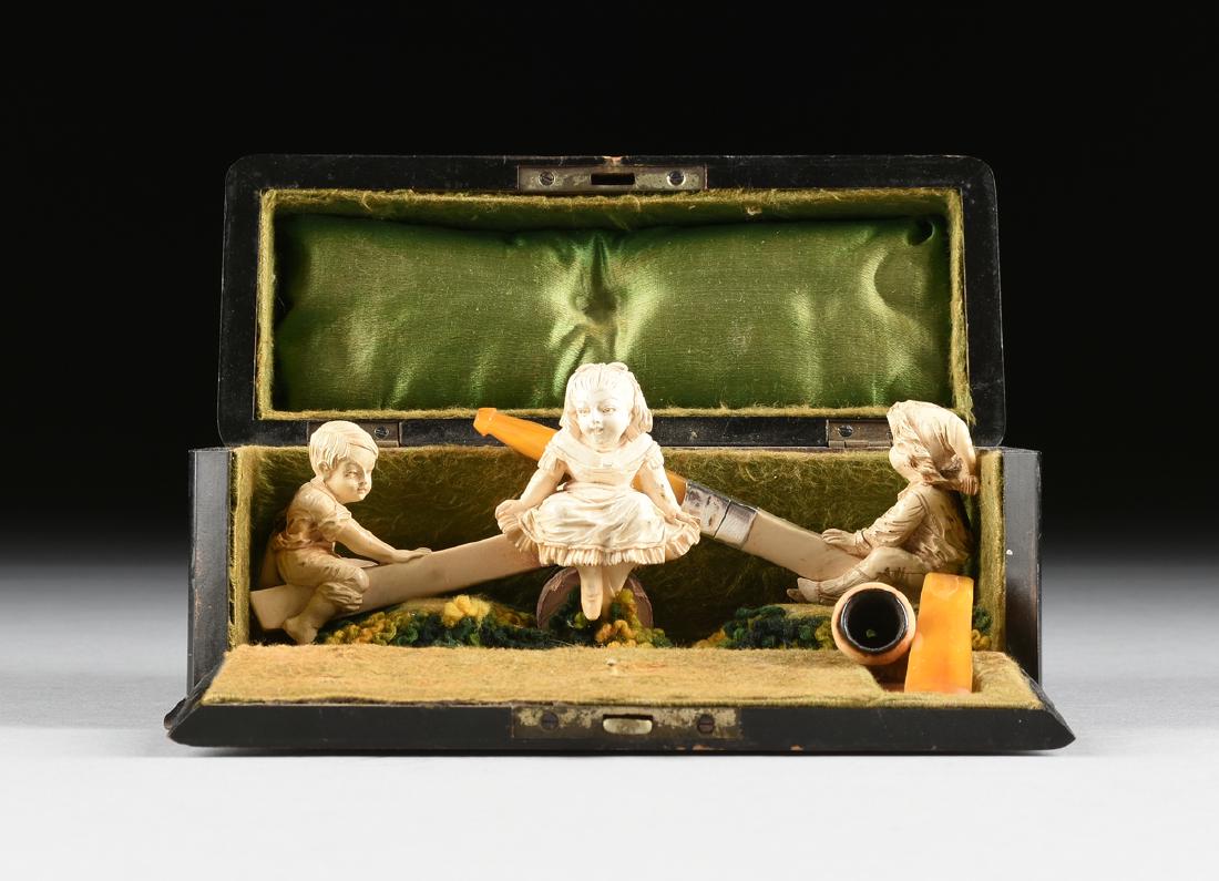 A CASED GROUP OF TWO CARVED MEERSCHAUM PIPES AND A (1 of 11)