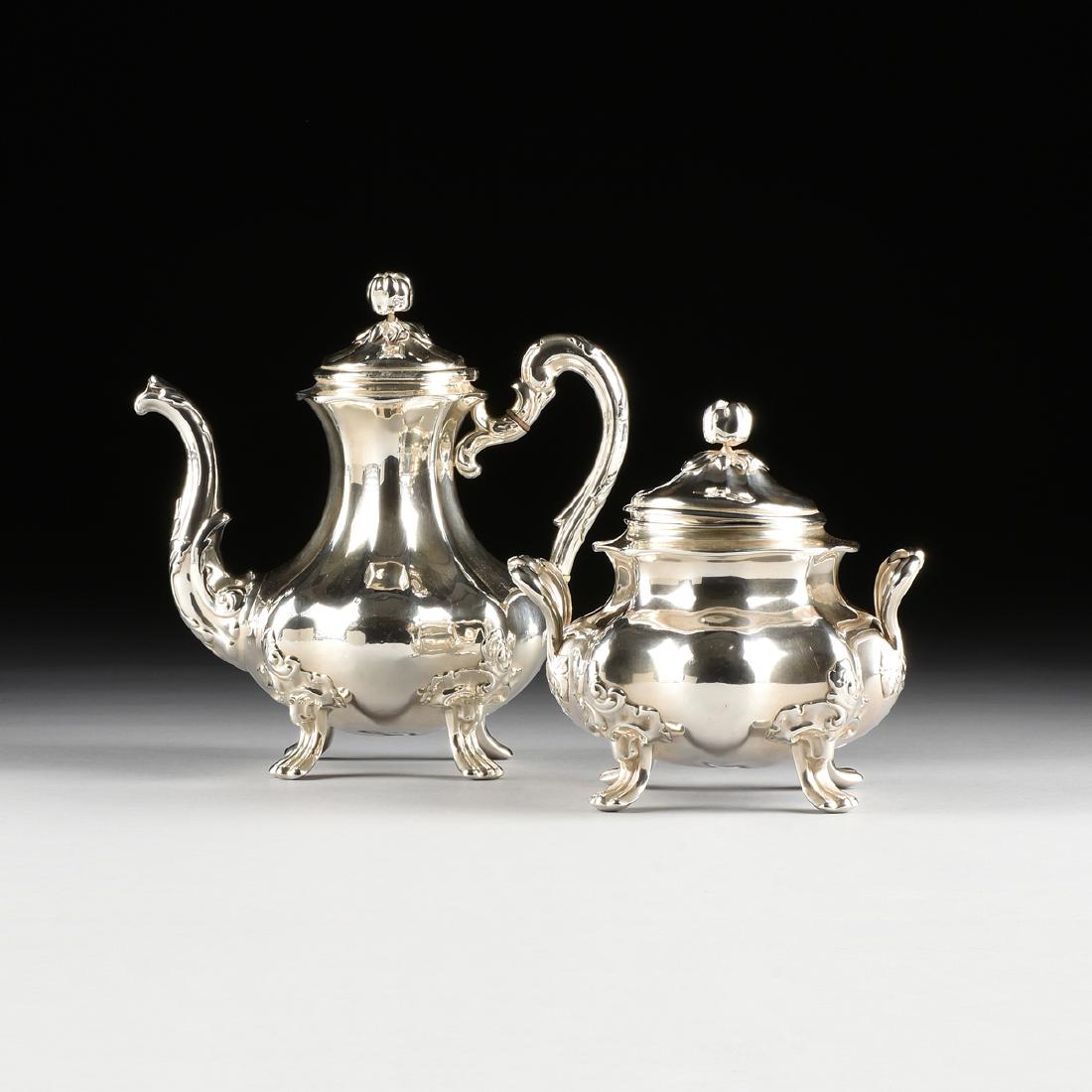 A GROUP OF TWO ALPHONSE-EDOUARD DEBAIN AND: A GROUP OF TWO ALPHONSE-EDOUARD DEBAIN AND LOUIS-FREDERIC FLAMANT 950 STANDARD SILVER TEA ITEMS, PARIS, FRANCE, 1864-1880, comprising a baluster form lobed teapot with scrolled handle fitted with bone
