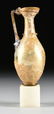 A GROUP OF TWO ANCIENT ROMAN BLOWN GLASS VESSELS, AD - 2