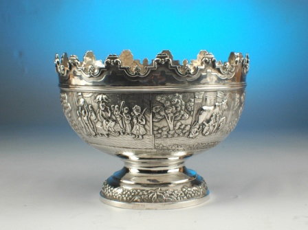 A BRITISH RAJ SILVER REPOUSSÉ PUNCH BOWL, the Mon
