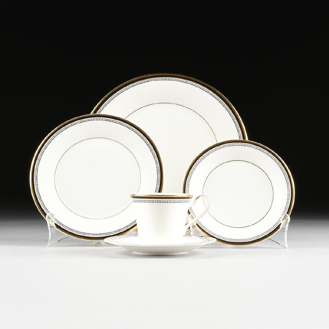 A SIXTY-THREE PIECE ROYAL DOULTON GILT AND ENAMEL: A SIXTY-THREE PIECE ROYAL DOULTON GILT AND ENAMEL DECORATED BONE CHINA TABLEWARE SERVICE IN THE "PAVANNE" PATTERN, STOKE-ON-TRENT, ENGLAND, designed 1983, each with gilt rim and border flanking black 