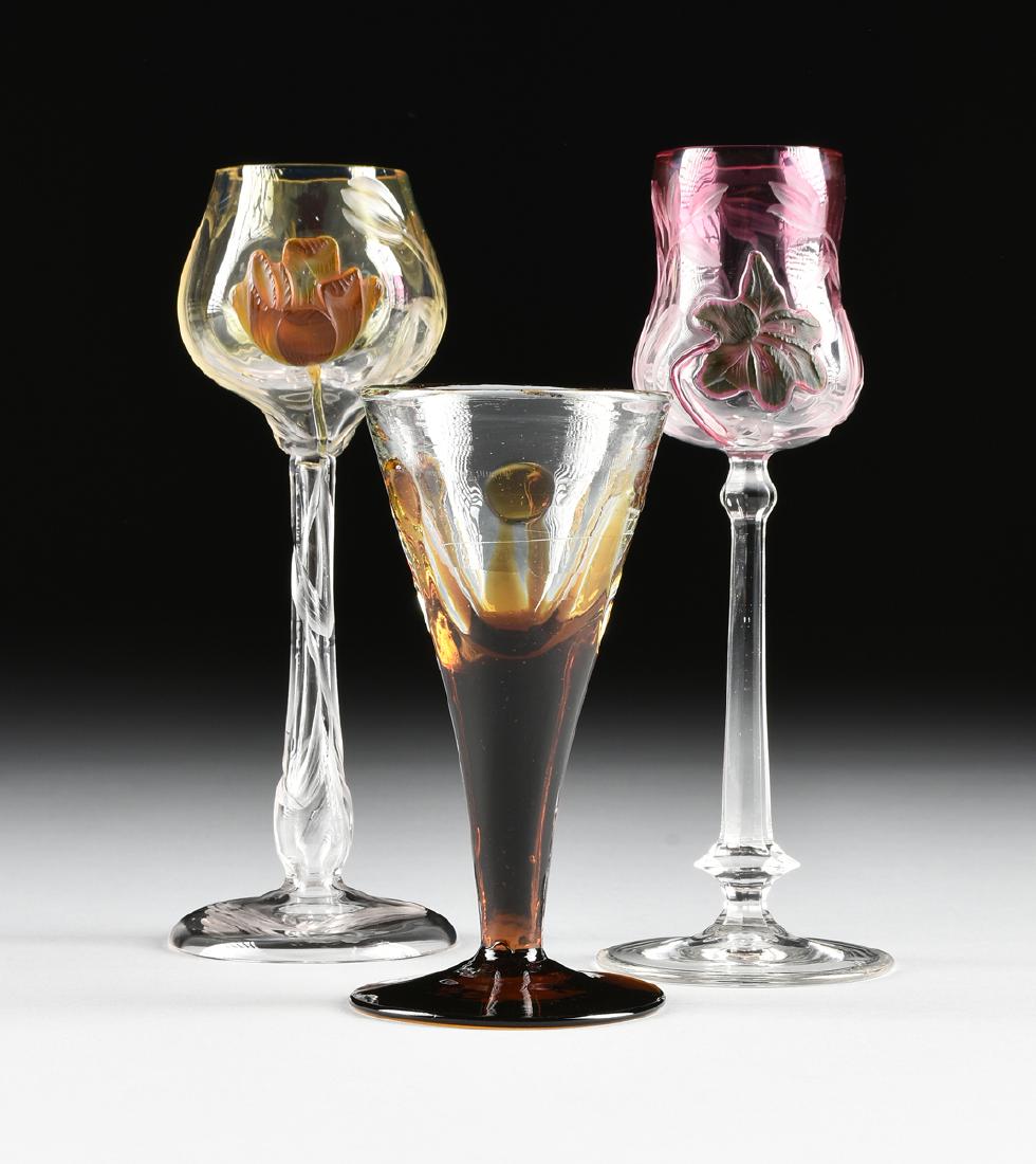A GROUP OF TWO LUDWIG MOSER & SOHNE ETCHED CASED CAMEO: A GROUP OF TWO LUDWIG MOSER & SOHNE ETCHED CASED CAMEO GLASS WINE GLASSES, KARLSBAD (KARLOVY VARY), BOHEMIA, CIRCA 1900, comprising a wine glass with cased topaz-yellow optic glass cut to clear teardr