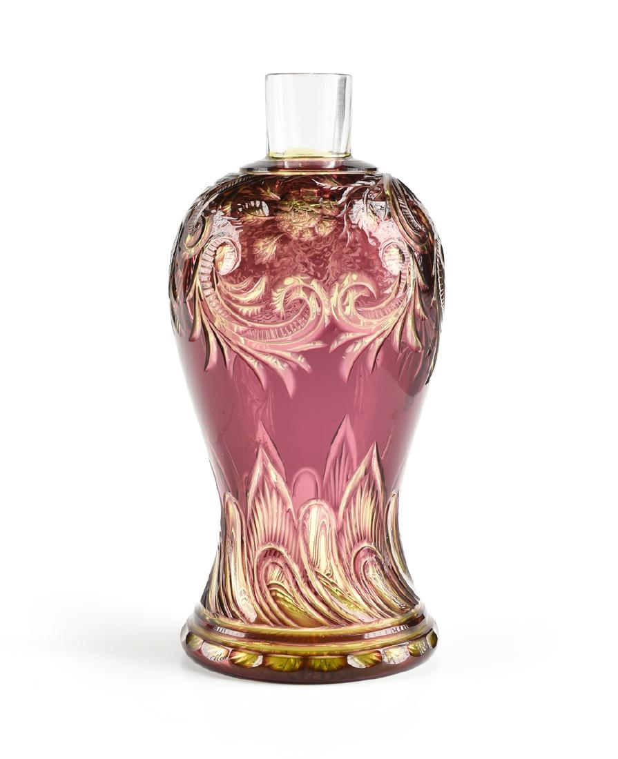 A STEVENS & WILLIAMS CASED, CUT, AND ENGRAVED COLOGNE: A STEVENS & WILLIAMS CASED, CUT, AND ENGRAVED COLOGNE BOTTLE, STOURBRIDGE, ENGLAND, CIRCA 1890-1900, of baluster form cased in amethyst glass over citrine over clear, with cut and engraved scroll and 