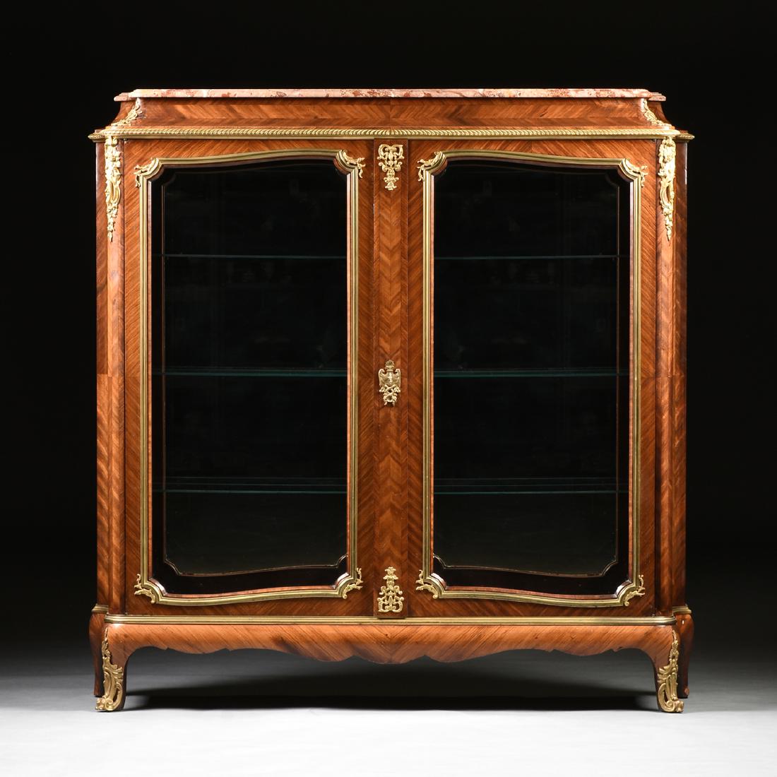 attributed to the workshop of JOSEPH EMMANUEL ZWIENER: attributed to the workshop of JOSEPH EMMANUEL ZWIENER (1849-1925) A BELLE ÉPOQUE LOUIS XV STYLE GILT BRONZE MOUNTED KINGWOOD AND ROSEWOOD INLAID CABINET, GERMAN, CIRCA 1900, the shaped and molded edg