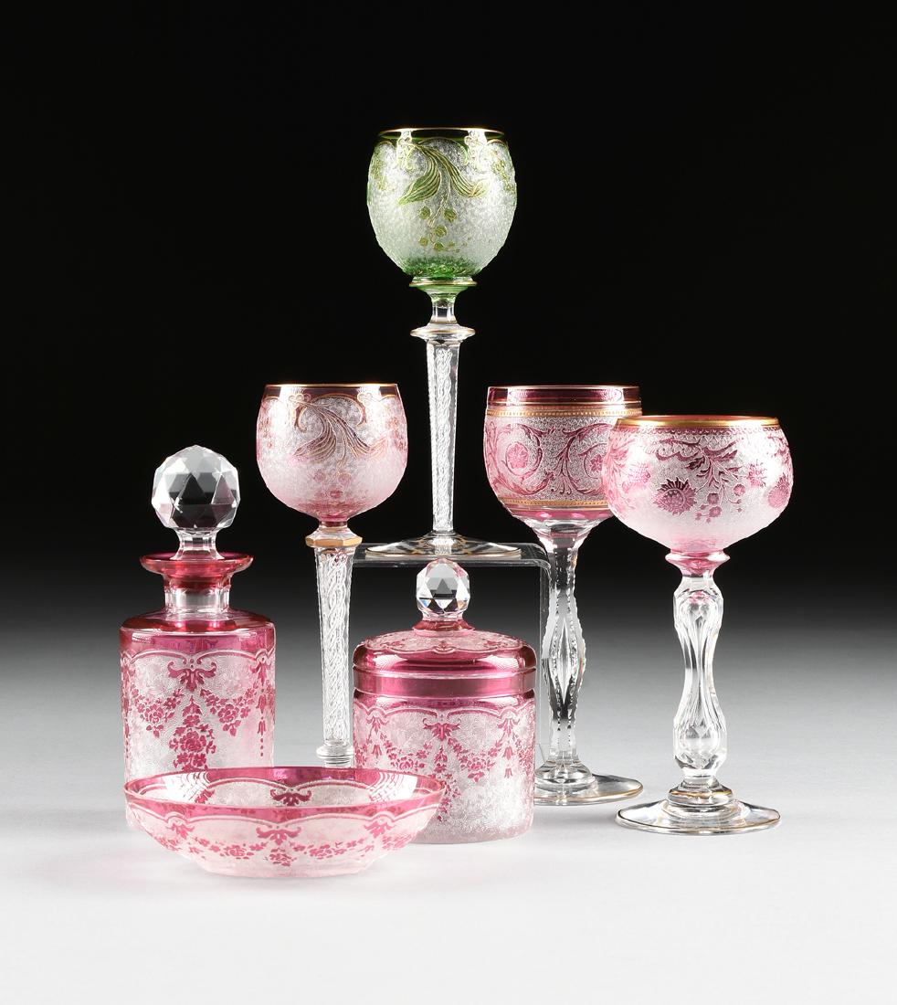 A GROUP OF SEVEN VAL ST. LAMBERT FLASHED GLASS VESSELS: A GROUP OF SEVEN VAL ST. LAMBERT FLASHED GLASS VESSELS WITH GILT AND ETCHED DECORATION, SERAING, BELGIUM, CIRCA 1900-1920, comprising a cranberry flashed scent bottle cut to clear, the cylindrical for
