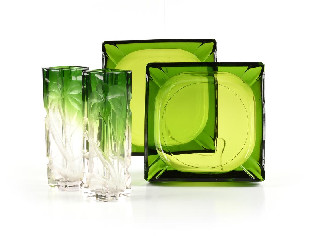A GROUP OF FOUR GREEN GLASS VESSELS, CIRCA 1920-1970,: A GROUP OF FOUR GREEN GLASS VESSELS, CIRCA 1920-1970, comprising a pair of Ludwig Moser & Sohne green cut to clear rectangular vases with intaglio cut iris decoration, Karlsbad (Karlovy Vary), Bohemia