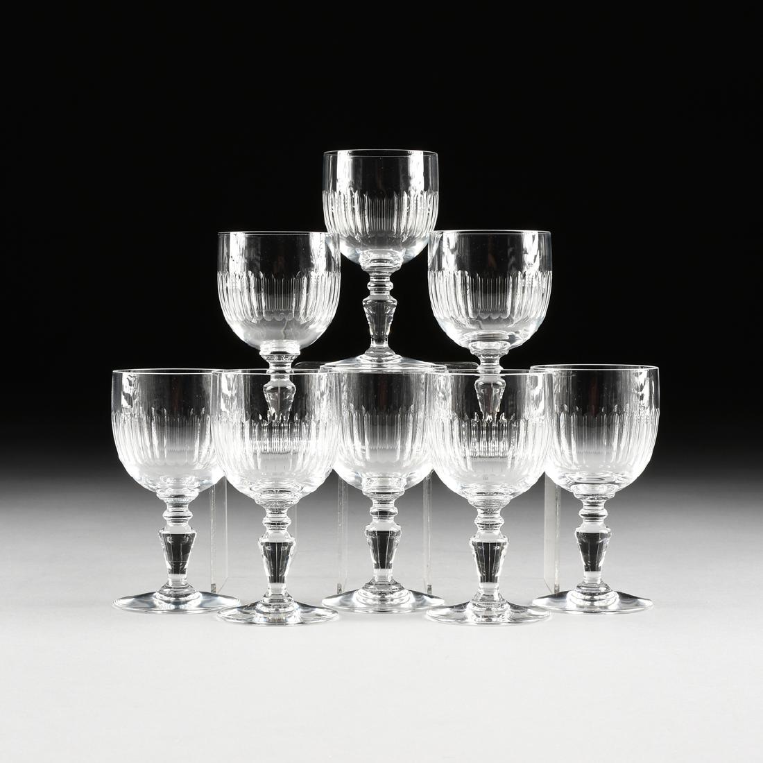 A SET OF EIGHT BACCARAT CLEAR CRYSTAL CLARET WINE: A SET OF EIGHT BACCARAT CLEAR CRYSTAL CLARET WINE GLASSES IN THE "RENAISSANCE" PATTERN, FRANCE, DESIGNED 1959, the ovoid shape bowl with a band of vertical cuts, raised on a tapering knopped baluster 