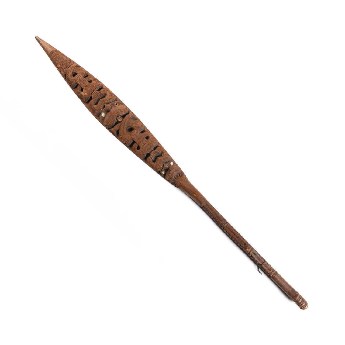A PRIMITIVE CARVED TOTARA SHELL INLAID WAKA HOE PADDLE,: A PRIMITIVE CARVED TOTARA SHELL INLAID WAKA HOE PADDLE, ATTRIBUTED TO MAORI TRIBE, NEW ZEALAND, EARLY/MID 20TH CENTURY, the kakau/handle is carved with four saw tooth repeating patterns, over a tinana
