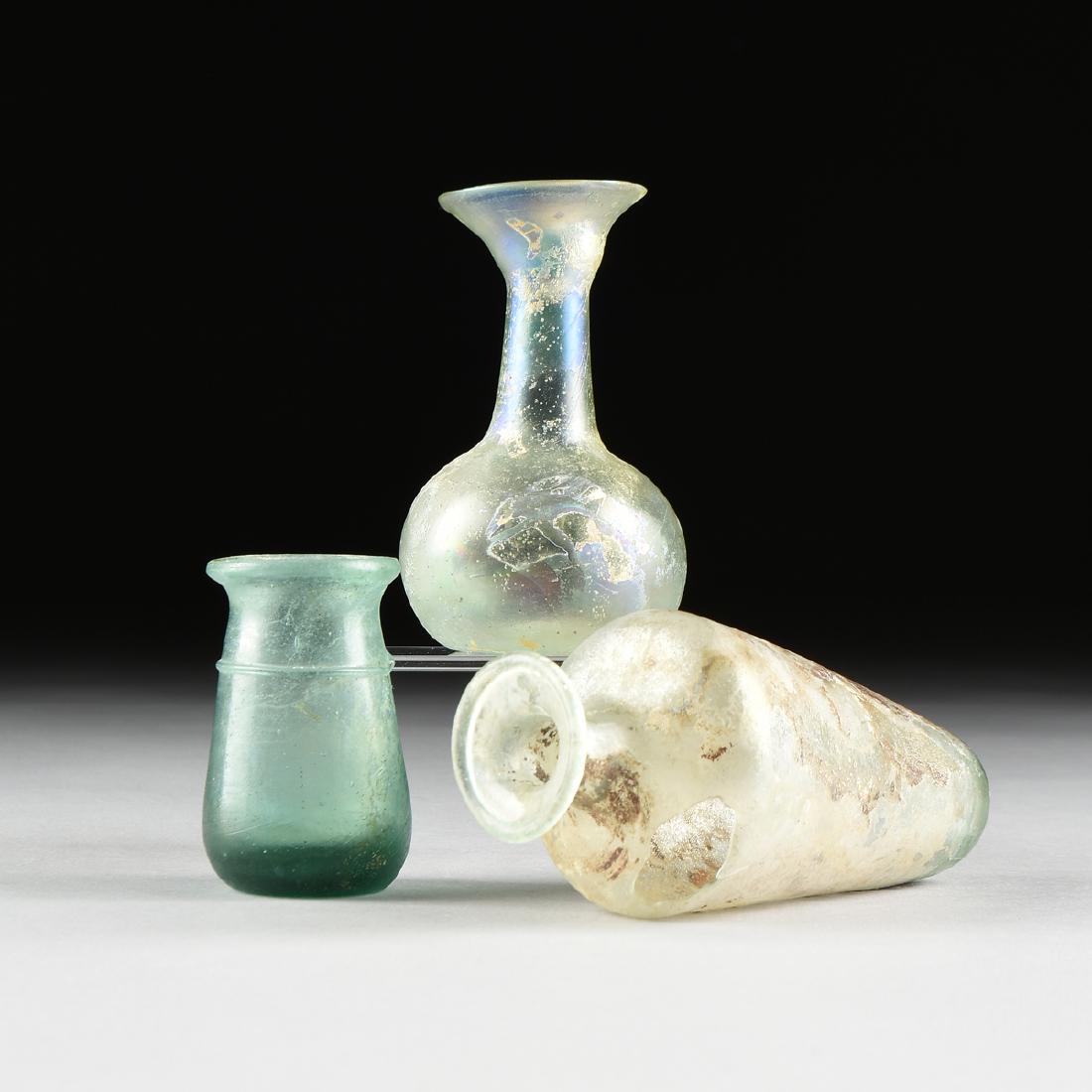 A GROUP OF THREE ANCIENT ROMAN GLASS UNGUENTARIUM, (1 of 14)