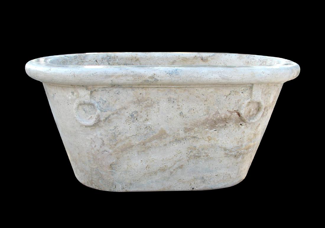 AN ANCIENT ROMAN STYLE TRAVERTINE LIMESTONE FREE STAND: AN ANCIENT ROMAN STYLE TRAVERTINE LIMESTONE FREE STAND SOAKING TUB, MODERN, a single block of russet, gray and cream figured stone, with flat rim terminating in a rolled edge, over a tapered oval basi