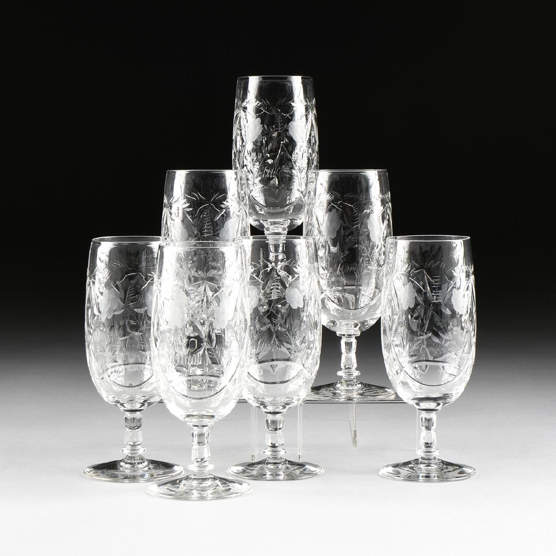 A SET OF SEVEN ROCK SHARPE CUT OPTIC GLASS ICE TEA: A SET OF SEVEN ROCK SHARPE CUT OPTIC GLASS ICE TEA STEMS IN THE "VILLARS" PATTERN, CATARACT-SHARPE MFG. CO., BUFFALO, NEW YORK, CIRCA 1940, of paneled optic glass, the sides with interlaced and diamon