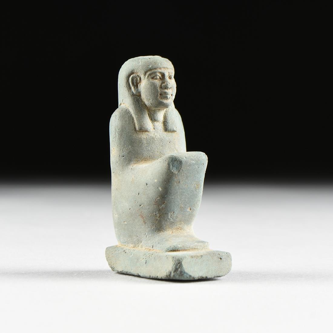 AN ANCIENT EGYPTIAN FAIENCE VOTIVE FIGURE OF THE