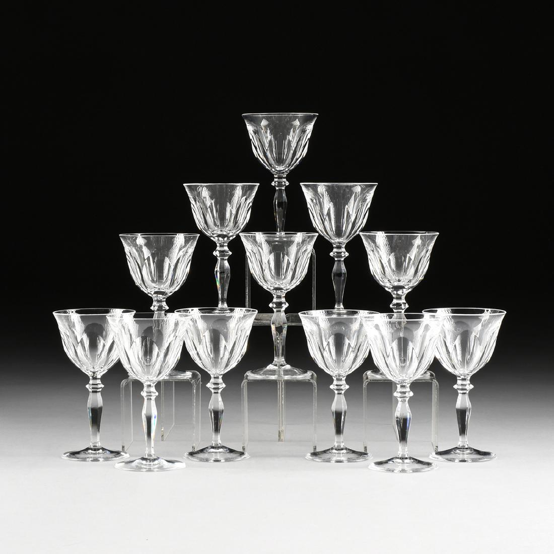 A SET OF TWELVE PEILL & PUTZLER CUT CRYSTAL WINE: A SET OF TWELVE PEILL & PUTZLER CUT CRYSTAL WINE GLASSES IN THE "RHEINLAND" PATTERN, DUREN, GERMANY, CIRCA 1960, the bell form bowls with a band of slice cuts at the base leading to faceted knop over 