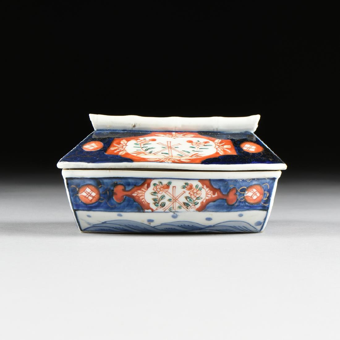 AN IMARI ENAMELED PORCELAIN YAKATABUNE BOAT FORM: AN IMARI ENAMELED PORCELAIN YAKATABUNE BOAT FORM COVERED DISH, MEIJI (1868-1912) PERIOD, the handle of bamboo form, over a lid in the form of a roof, painted with a Buddhist wheel form and flowers, ov