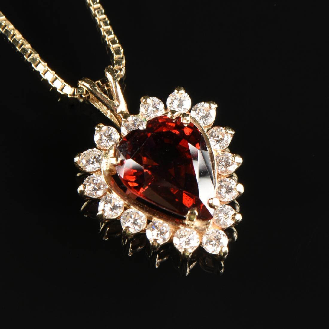 A 14K YELLOW GOLD, GARNET, AND DIAMOND LADY'S PENDANT (1 of 1)