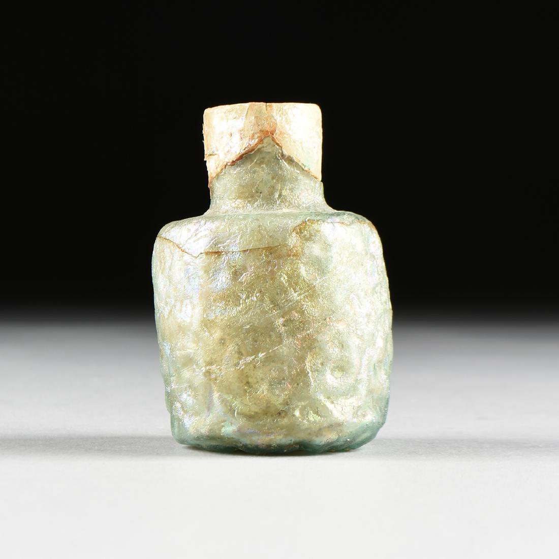 AN EARLY ISLAMIC MOLD BLOWN BLUE GREEN GLASS BOTTLE, (1 of 6)