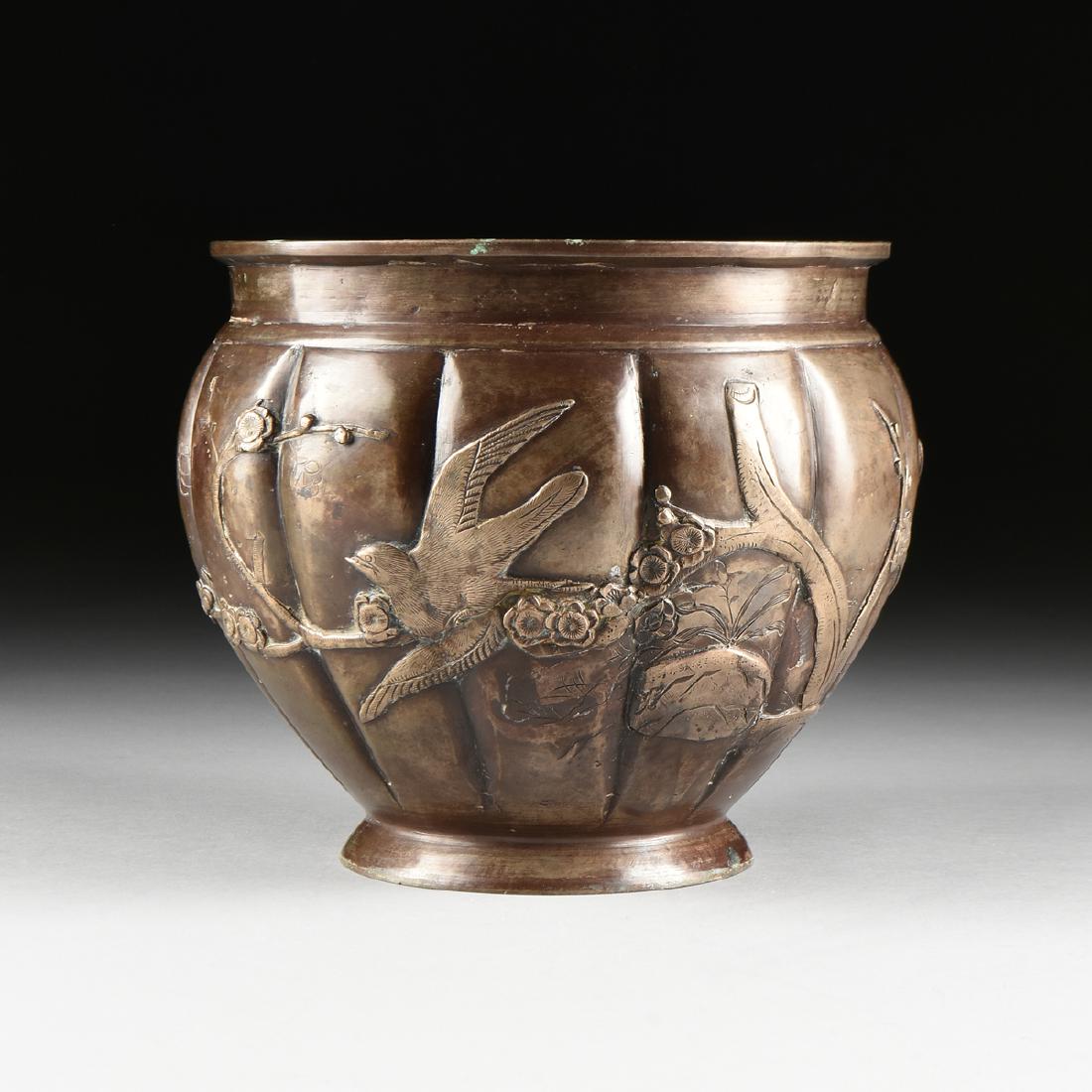 A JAPANESE LATE MEIJI PERIOD BRONZE URN WITH APPLIED: A JAPANESE LATE MEIJI PERIOD BRONZE URN WITH APPLIED SILVERED DECORATION, CIRCA 1880-1900, of overall ovoid form with ribbed sides, with applied silvered metal flowering prunus branches, birds, and ro