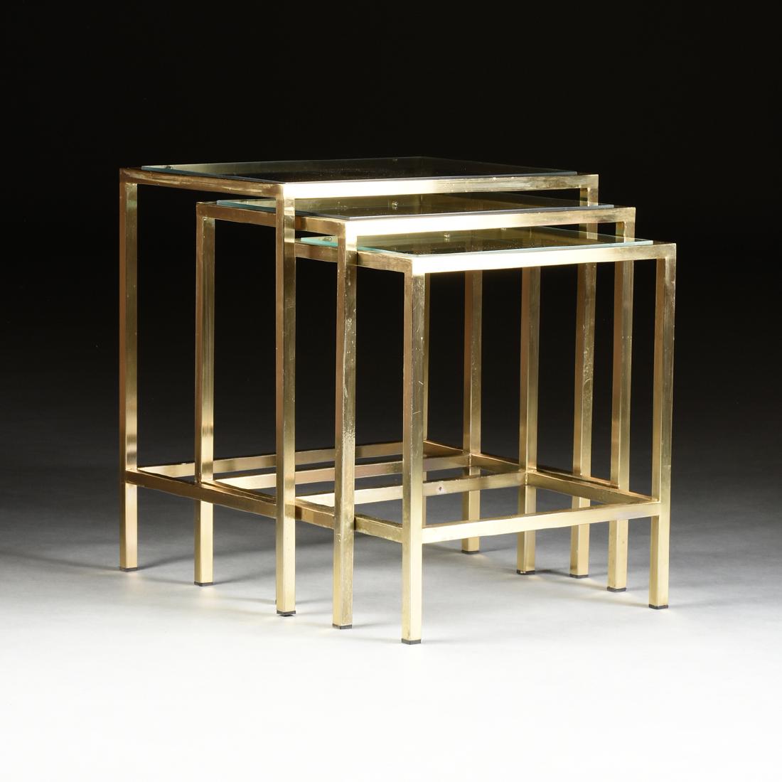 A SET OF THREE ITALIAN MID CENTURY MODERN BRASS AND: A SET OF THREE ITALIAN MID CENTURY MODERN BRASS AND GLASS NESTING TABLES, CIRCA 1970-1980, executed in three quarter inch square section lacquered polished brass tubing with glass inset tops, the set 