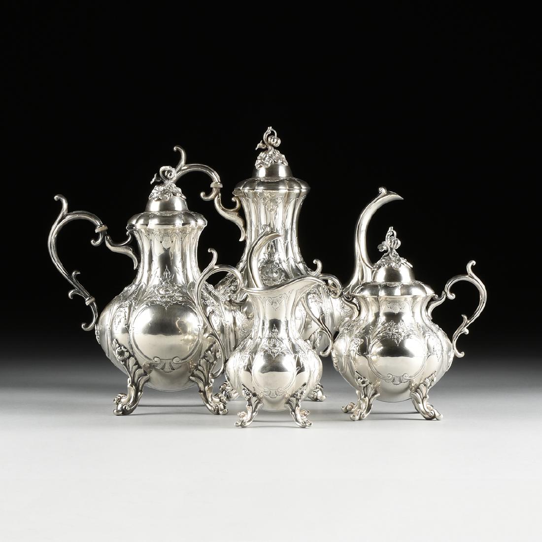 A FOUR PIECE REED & BARTON SILVER PLATED TEA AND COFFEE: A FOUR PIECE REED & BARTON SILVER PLATED TEA AND COFFEE SERVICE IN THE "WINTHROP CHASED" PATTERN, TAUNTON, MASSACHUSETTS, 1952, comprising a coffee pot of lobed baluster form, the domed lid with scall