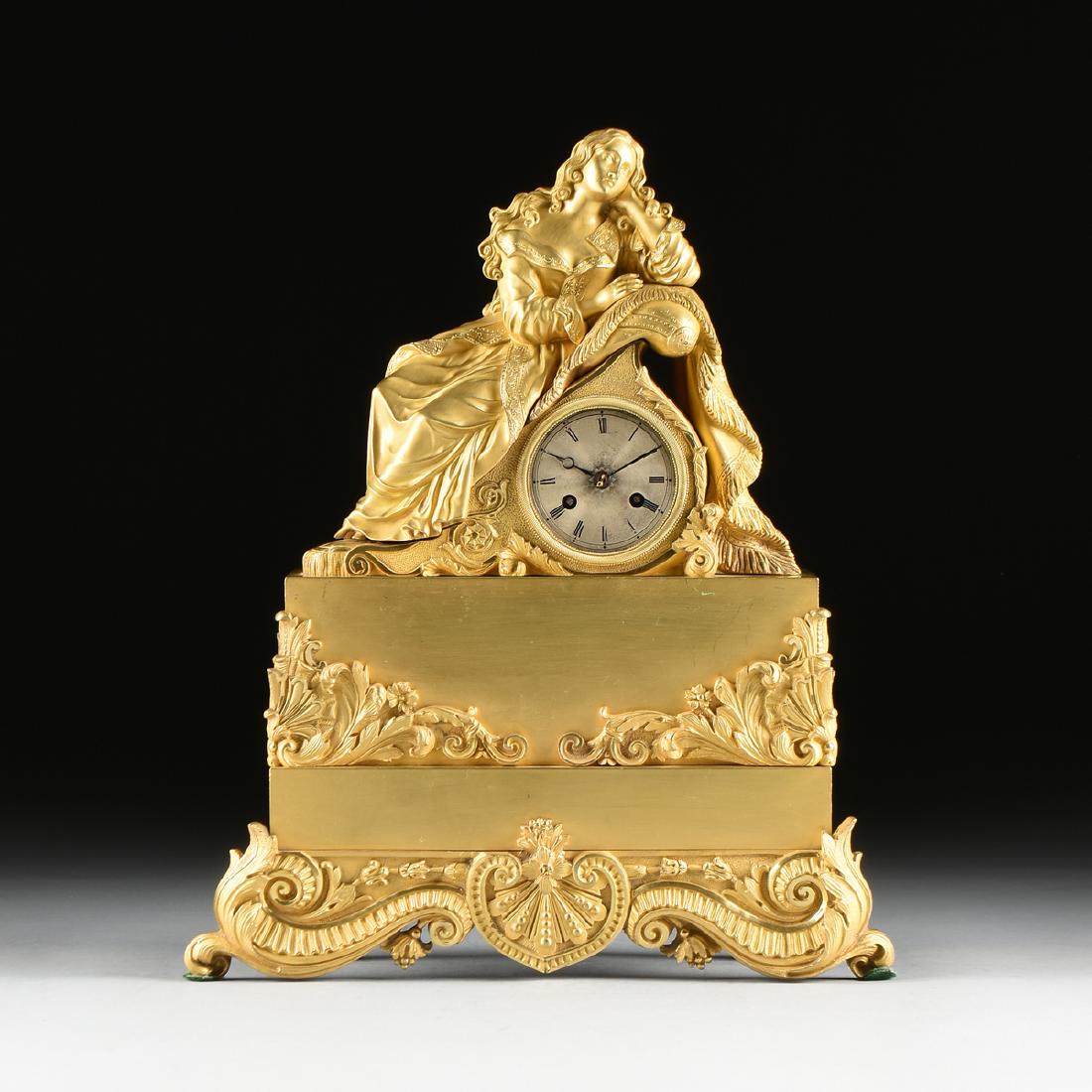 A FIGURAL MANTLE CLOCK, LATE LOUIS PHILIPE GILT BRONZE,: A FIGURAL MANTLE CLOCK, LATE LOUIS PHILIPE GILT BRONZE, MOVEMENT BY DOUILLON, CIRCA 1845, in the Rococo Revival style, with a silvered circular dial enclosing black Roman chapters and reticulated hand