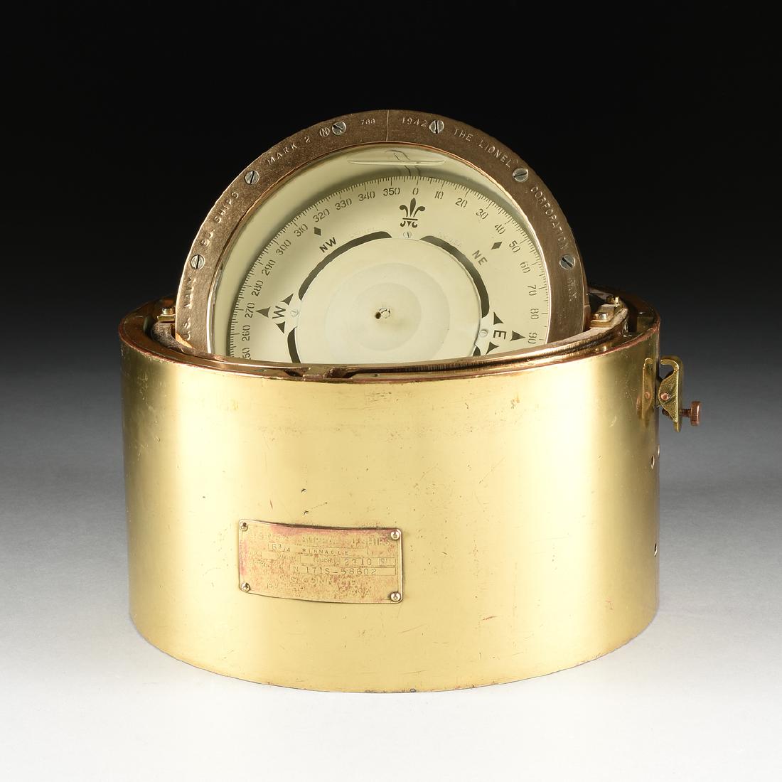 A U.S. NAVY BUREAU OF SHIPS BRASS 6 3/4 BINNACLE BY THE: A U.S. NAVY BUREAU OF SHIPS BRASS 6 3/4 BINNACLE BY THE LIONEL CORPORATION, NEW YORK, CIRCA 1942, the domed cap opening with two ball finials and doors to a wet compass with a fleur-de-lis north point