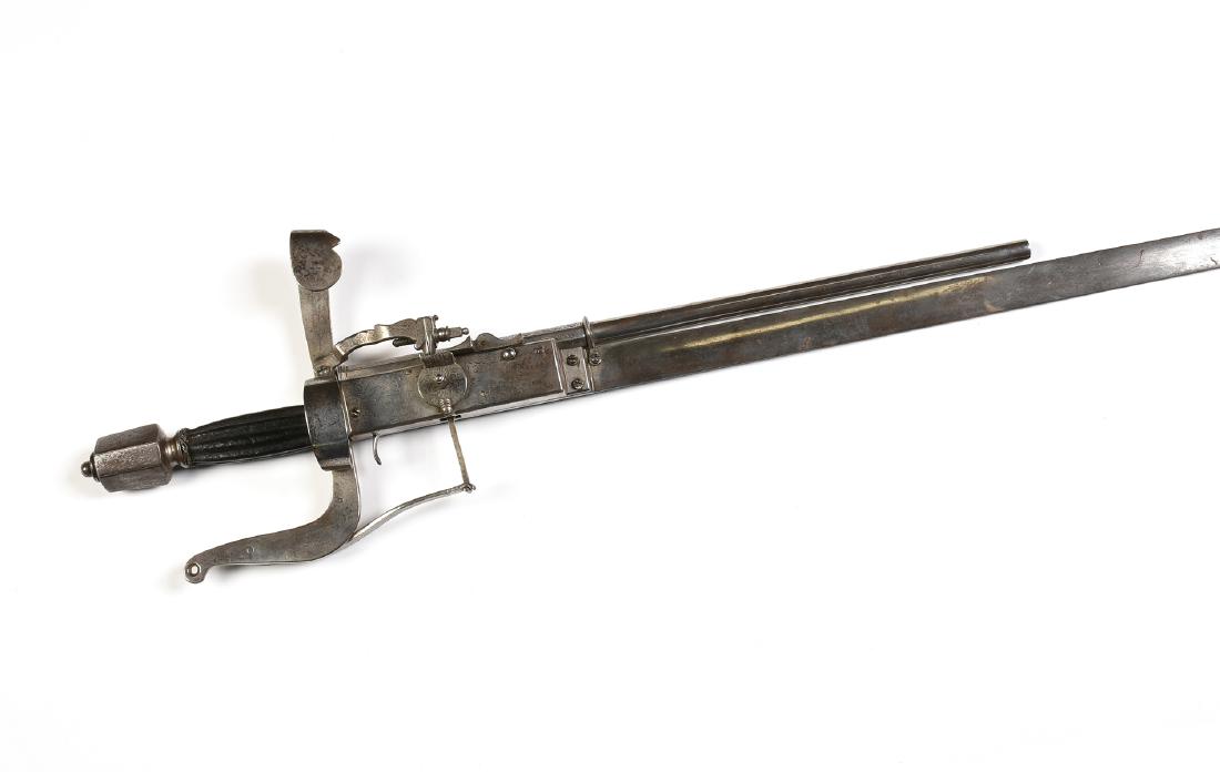 A VICTORIAN POLISHED AND ETCHED STEEL FLINT LOCK WHEEL: A VICTORIAN POLISHED AND ETCHED STEEL FLINT LOCK WHEEL PISTOL SABRE, SECOND HALF 19TH CENTURY, the tapering pointed blade and ricasso with stylized "S" form guard, mounted with a trigger mechanism, on