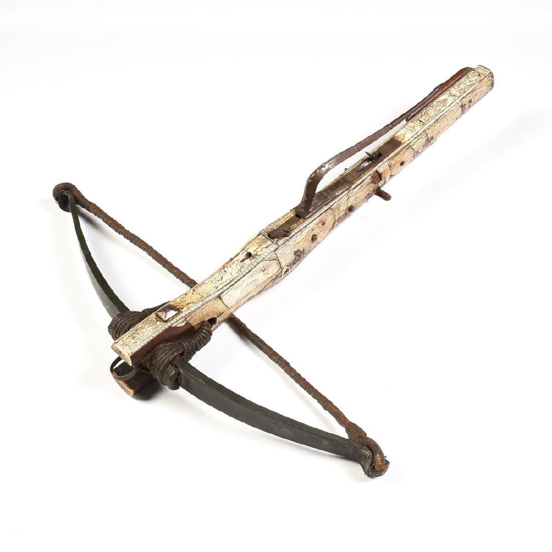 A BAVARIAN RENAISSANCE MOTHER-OF-PEARL AND BONE INLAID: A BAVARIAN RENAISSANCE MOTHER-OF-PEARL AND BONE INLAID FRUITWOOD CROSSBOW, ENGRAVED "DH," DANIEL HOPFER (German 1470-1563) 15TH/16TH CENTURY, the crossbow mounted with hand forged iron lathe with blac