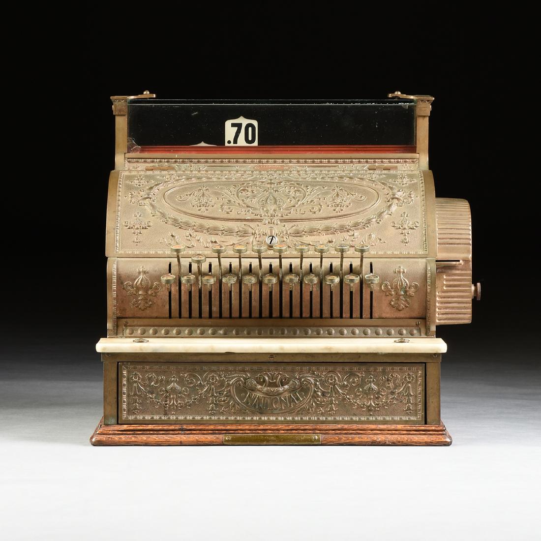 A NATIONAL CASH REGISTER COMPANY BRASS, OAK, AND: A NATIONAL CASH REGISTER COMPANY BRASS, OAK, AND CARRERA MARBLE MODEL 337 TWENTY-ONE KEY TOTAL ADDER WITH DETAIL STRIP PRINTER REGISTER, DAYTON, OHIO, 1912, the dolphin form case in solid cast brass w