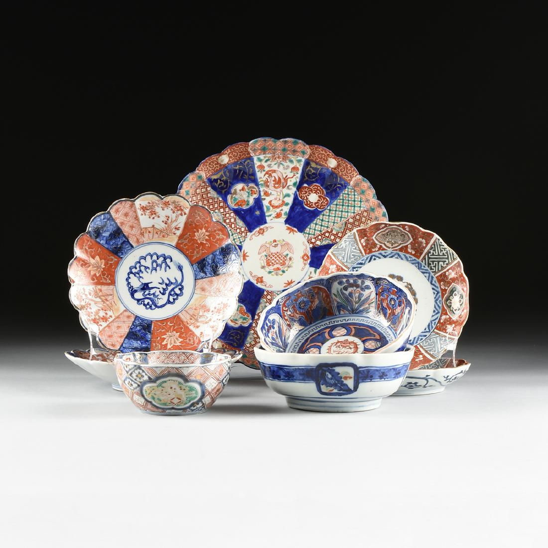 A GROUP OF EIGHT PARCEL GILT IMARI PORCELAIN BOWLS AND: A GROUP OF EIGHT PARCEL GILT IMARI PORCELAIN BOWLS AND PLATE, JAPANESE, MEIJI PERIOD (1868-1912), comprising a petal form plate with central hawk medallion within phoenix and lattice painted reserves,