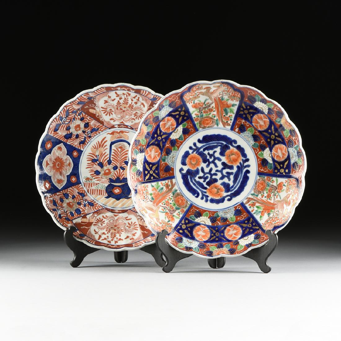 A GROUP OF TWO IMARI PARCEL GILT ENAMELED PORCELAIN: A GROUP OF TWO IMARI PARCEL GILT ENAMELED PORCELAIN EXPORT CHARGERS, JAPANESE, MEIJI (1868-1912)/TAISHO (1912-1926) PERIODS, consisting of two floriform edge plates, one with a central flowering baske