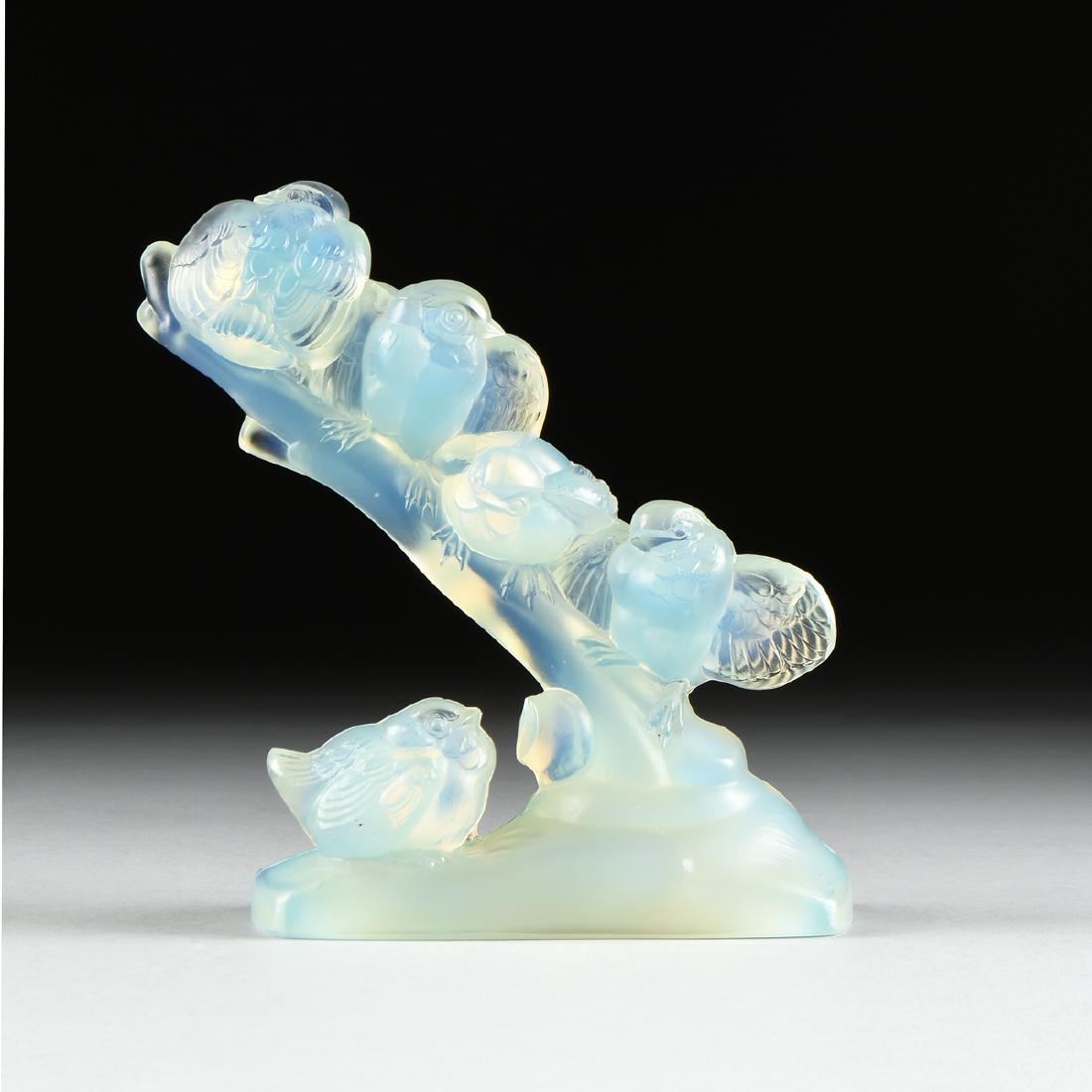 A SABINO SCULPTURE, "BRANCHE D'OISEAUX, PARIS, CIRCA: A SABINO SCULPTURE, "BRANCHE D'OISEAUX, PARIS, CIRCA 1920, opalescent molded glass, the branch filled with birds and a single bird waits below, signed "Sabino, Paris," verso. Height: 7 3/4" Width: 6" 