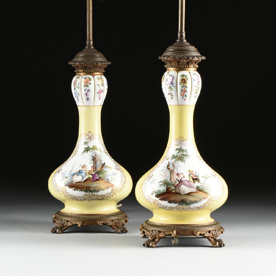 A PAIR OF MEISSEN STYLE ROCOCO REVIVAL BRONZE MOUNTED: A PAIR OF MEISSEN STYLE ROCOCO REVIVAL BRONZE MOUNTED PORCELAIN ONION FORM VASE LAMPS, CONTINENTAL, 1934-1938, the two light lamps over lobed garlic head form spouts, tapered necks and tapering globul