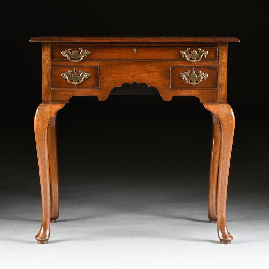 A QUEEN ANNE STYLE MAHOGANY LOWBOY DRESSING TABLE,: A QUEEN ANNE STYLE MAHOGANY LOWBOY DRESSING TABLE, ENGLISH, FIRST HALF 20TH CENTURY, the rectangular molded top, over a single, long frieze drawer, above two short drawers, all with cockbead molding,
