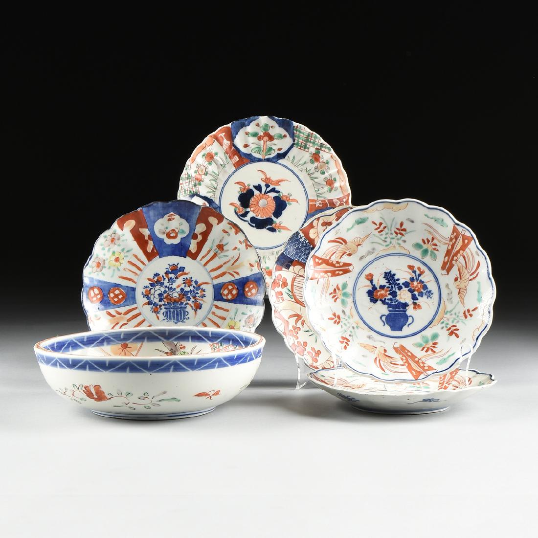 A GROUP OF SIX IMARI ENAMELED FLORIFORM PORCELAIN: A GROUP OF SIX IMARI ENAMELED FLORIFORM PORCELAIN PLATES AND A SERVING BOWL, JAPANESE, MEIJI PEIROD (1868-1912), comprising two plates with enameled phoenix with kite or fan centering a stenciled unde