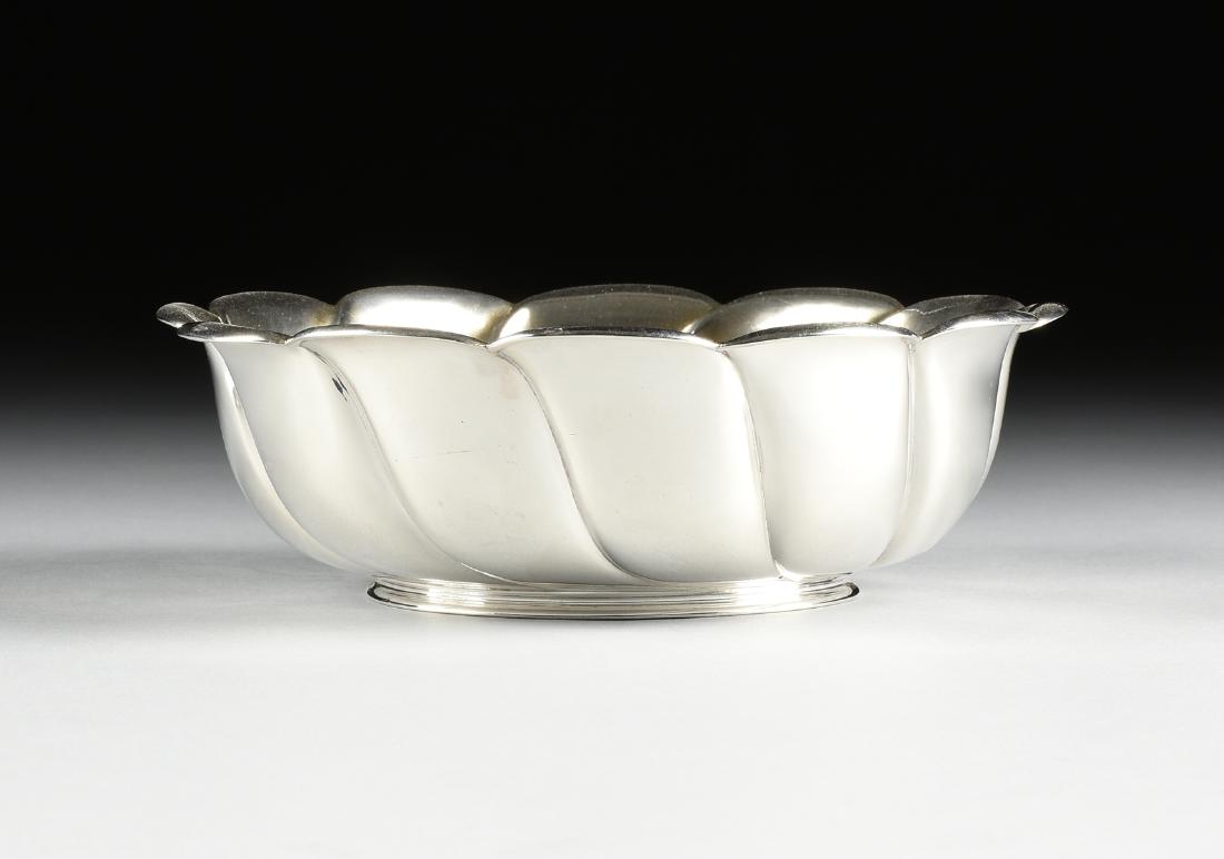 A TIFFANY & CO. STERLING SILVER SERVING BOWL, NEW YORK,: A TIFFANY & CO. STERLING SILVER SERVING BOWL, NEW YORK, NEW YORK, CIRCA 1886-1891 petal form with twisting lobed sides raised on flaring ring foot, engraved "Libbie;" stamped "TIFFANY & Co., 9049 MAKE